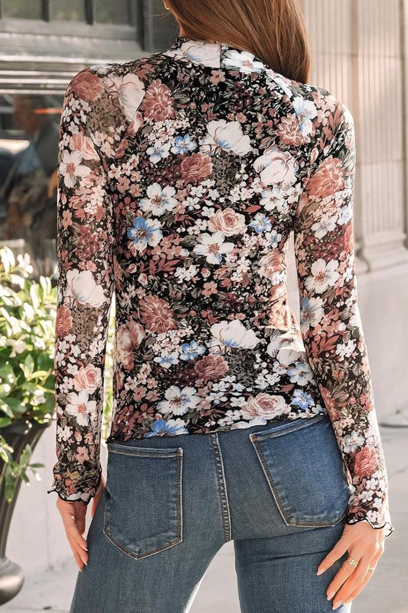 Back of model wearing a long sleeve mesh top with a floral pattern and a crew