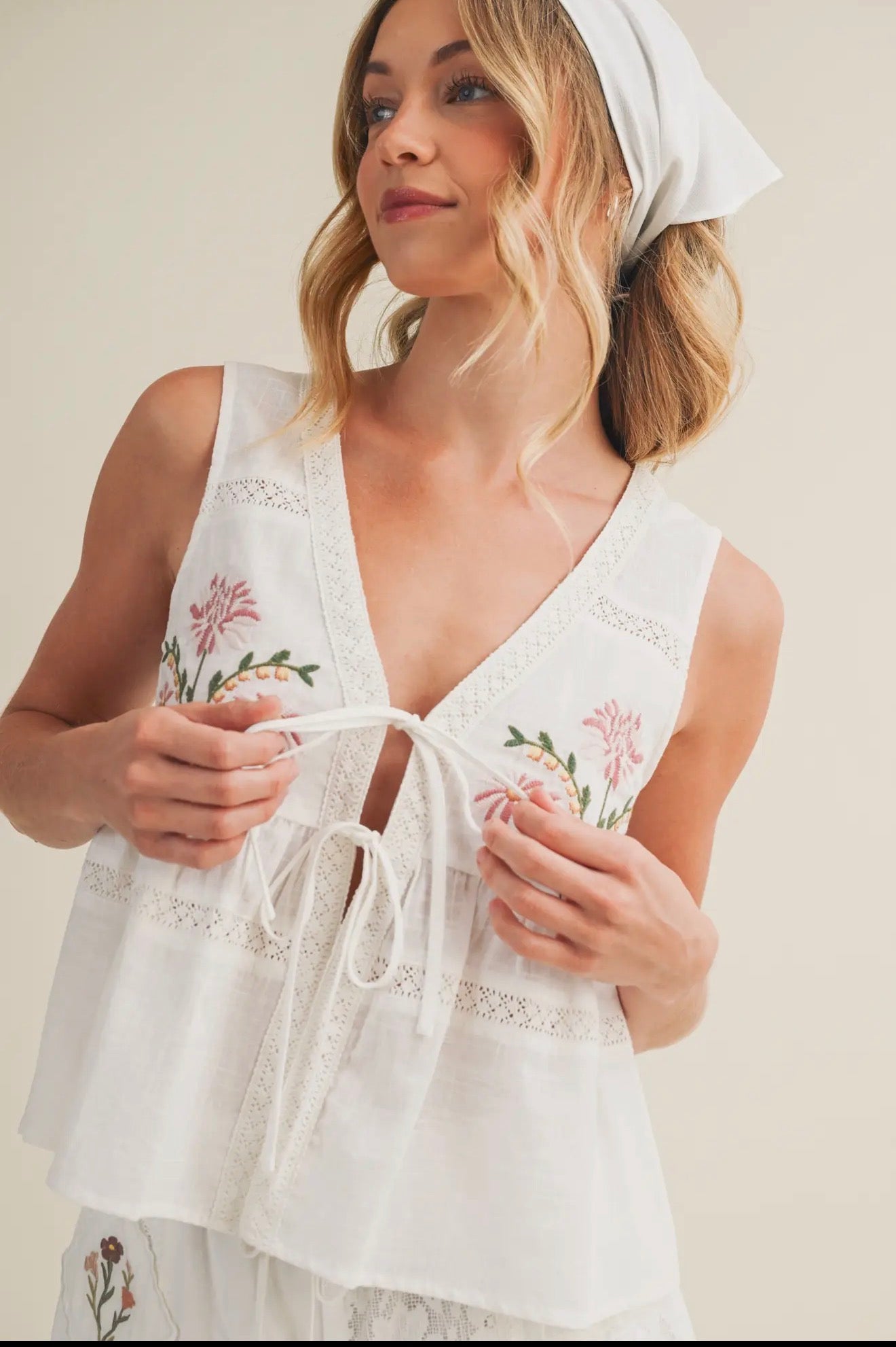 Women’s embroidered tie front babydoll top with floral details
